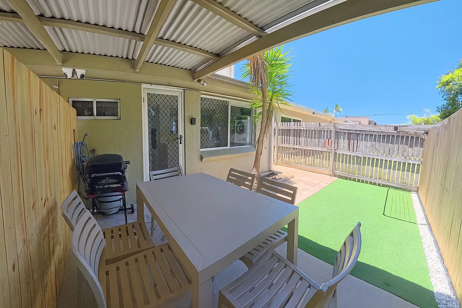 Yeppoon Unit 1 outdoor area with BBQ and dining table